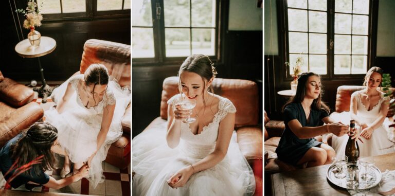 Une mariée est assise sur un canapé avec un verre de vin, magnifiquement capturée par un photographe mariage Landais.