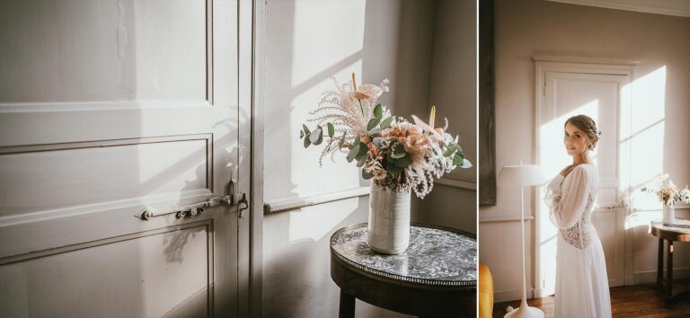 Une mariée vêtue d'une robe blanche debout devant une fenêtre, prête pour son mariage.